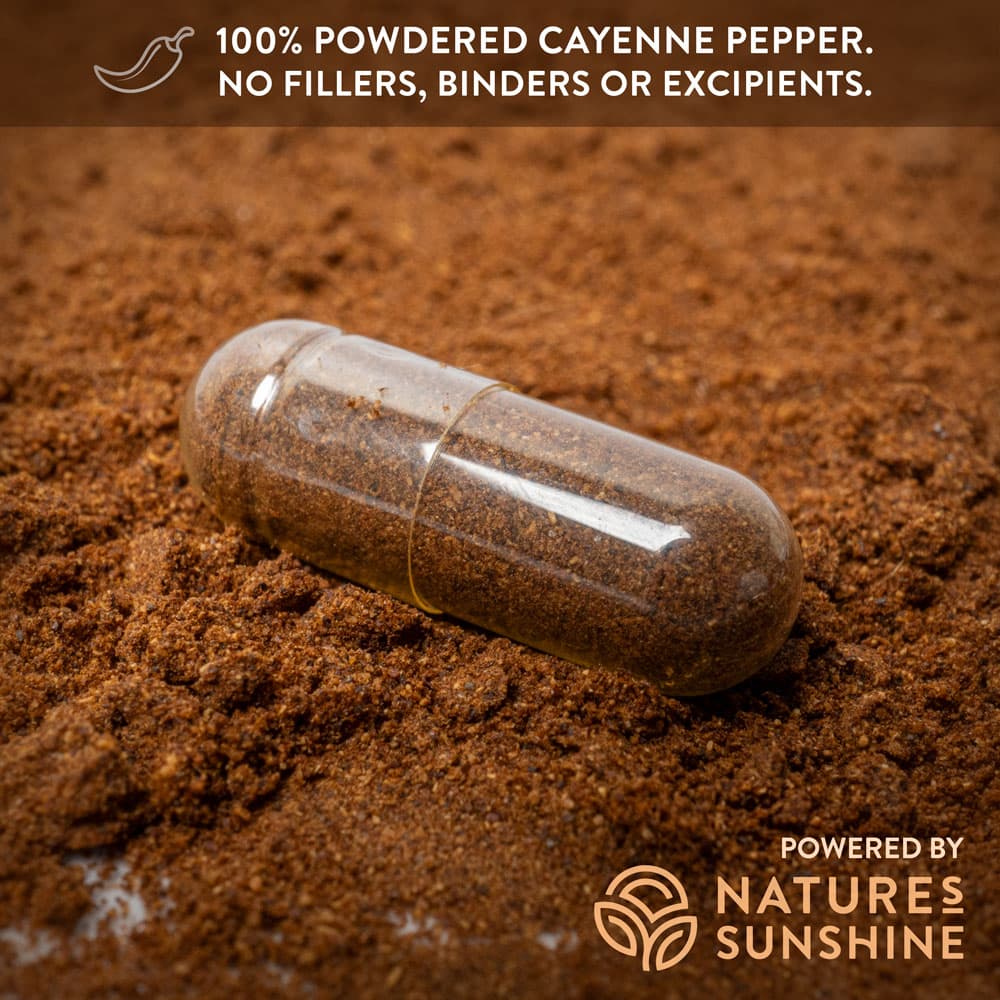 macro close up photo of capsicum capsule with the caption "100% powdered cayenne pepper. No fillers, binders or excipients."